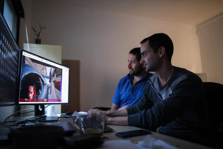 Researchers Shachar Honig (left), 35, and Sarel Duanis (right), 29, look at videos and effects in an office at Lightricks, a startup that creates applications for photo and video editing, in Jerusalem, February 28, 2019.