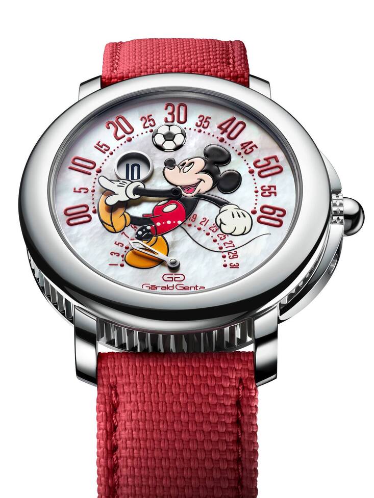 Die Uhr hat ein rotes Lederarmband.