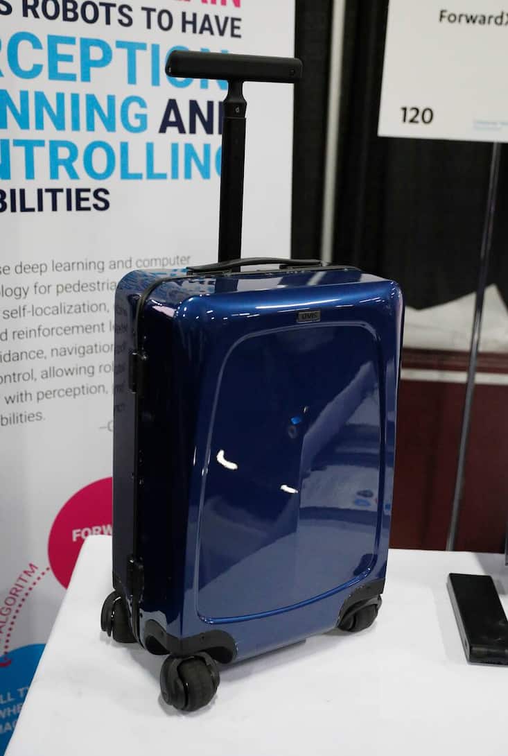 The Ovis Suitcase is on display at the ForwardX booth during CES Unveiled at CES International, Sunday, Jan. 6, 2019, in Las Vegas. The suitcase will automatically follow the user at their side as they walk.(AP Photo/John Locher)