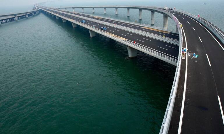 completed-in-2011-chinas-jiaozhou-bay-bridge-is-the-worlds-longest-cross-sea-bridge-stretching-nearly-26-miles-almost-the-length-of-a-marathon-it-cut-travel-time-in-half-.jpg