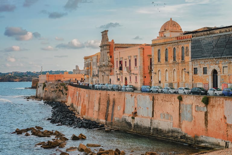Embankment at old city in Siracusa and Mediterranean sea Sicily